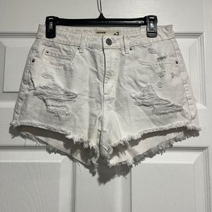 white denim shorts with distressed holes from garage
